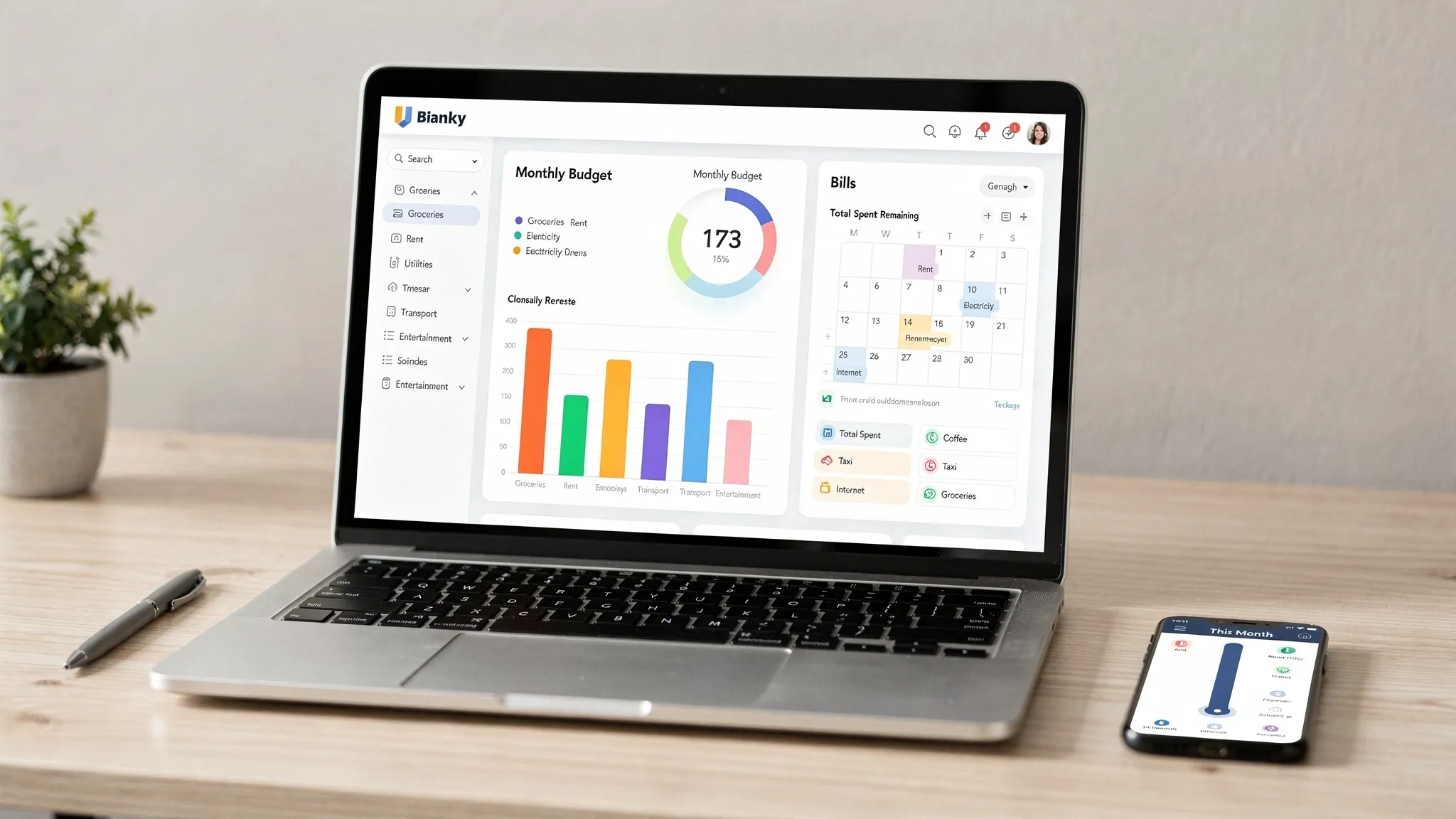 A clean personal finance dashboard shown on a laptop and a smartphone on a wooden desk, both screens oriented toward the viewer, displaying categorized expenses, a monthly budget progress bar, and a bill calendar. Natural daylight, tidy workspace, no content visible behind the laptop screen.
